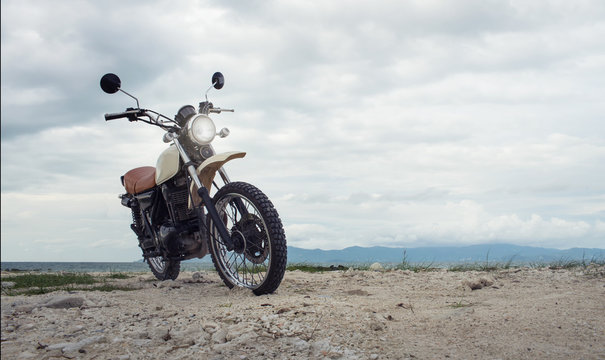 Freedom.Motorbike under sky.Vintage photo effect added for create atmosphere