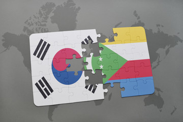 puzzle with the national flag of south korea and comoros on a world map background.