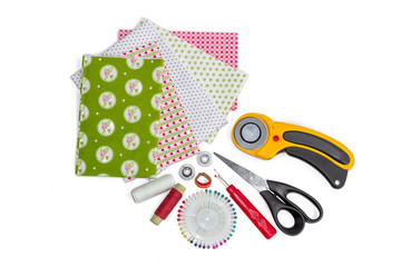 Composition of patchwork quilting instruments, items and fabrics