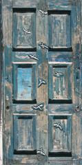 Blue old door carved with seagulls