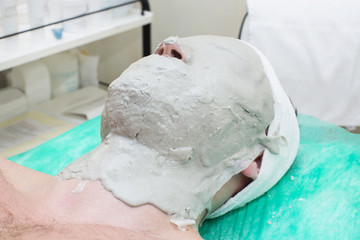 man in the mask cosmetic procedure in spa salon