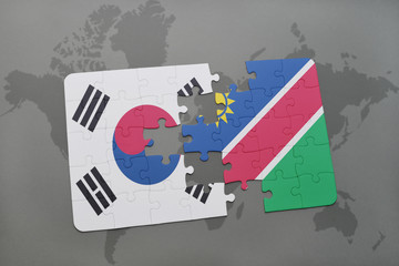 puzzle with the national flag of south korea and namibia on a world map background.