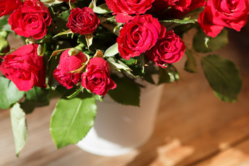 The bouquet of red roses in a vase