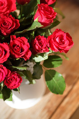 The bouquet of red roses in a vase