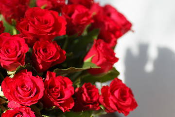 The bouquet of red roses in a vase