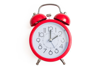 Red retro and vintage style bell alarm clock isolated on white background.