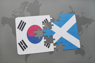 puzzle with the national flag of south korea and scotland on a world map background.