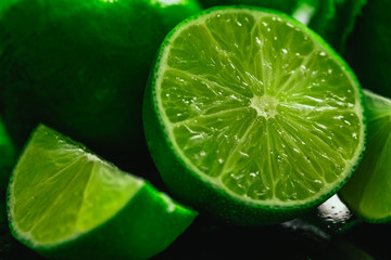 Fototapeta na wymiar Fresh green mint and lime close-up on a dark background