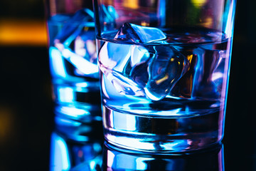 Two glasses of vodka with ice closeup
