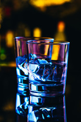 Two glasses of vodka with ice closeup