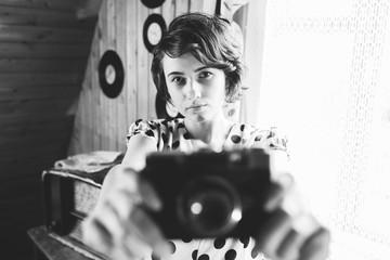 Portrait of Girl - photographer with old vintage photo camera