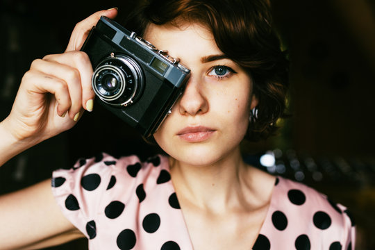 Portrait of Girl - photographer with old vintage photo camera