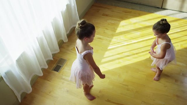 Young girls practicing ballet at home - 4k