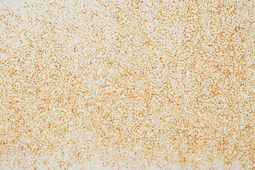 Brown rusty zinc texture background. Old zinc dot pattern vintage style. Surface yellow steel wall weathered. Pattern of decorative red dot painted.