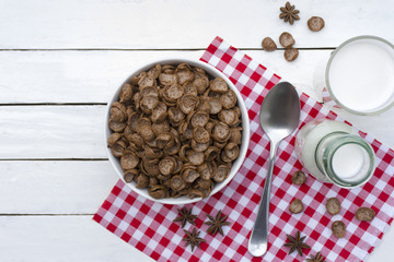 Cereal food and milk bottle and milk glass on wooden sky blue table.Meal or breakfast hi-vitamin and calcium.