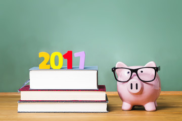 Class of 2017 theme with textbooks and piggy bank