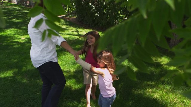 Mother and daughters playing in the park - 4k