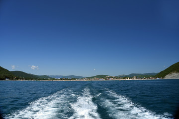 Summer travel to the black sea. Boiling blue water after boat