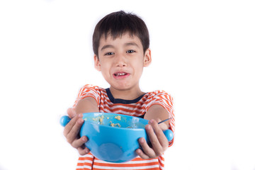 Little boy eating with happy face for his healthy meal time