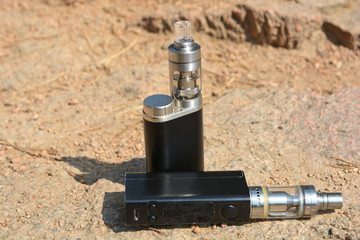 Electronic cigarette on natural stone background