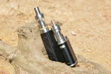 Electronic cigarette at the root of the tree