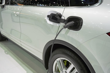 Fototapeta premium Car Power Plug in to electric car.