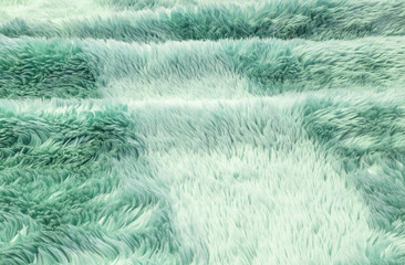 Closeup surface abstract fabric pattern at the green fabric carpet at the floor of house texture background