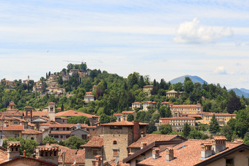 Fototapeta na wymiar Panorama of upper city Citta Alta with hill San Vigilio in Bergamo, Italy