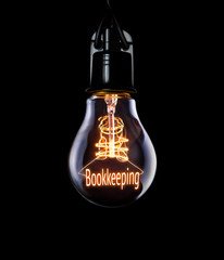 Hanging lightbulb with glowing Bookkeeping concept.