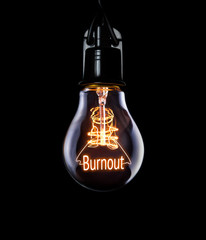Hanging lightbulb with glowing Burnout concept.