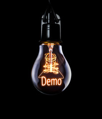 Hanging lightbulb with glowing Demo concept.