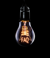 Hanging lightbulb with glowing FAQ concept. - obrazy, fototapety, plakaty