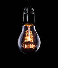 Hanging lightbulb with glowing Liability concept.