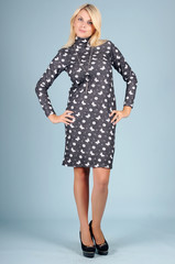 Beautiful young girl  posing on a blue background