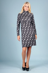 Beautiful young girl  posing on a blue background