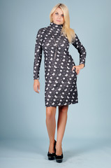 Beautiful young girl  posing on a blue background