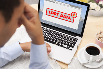 Businessman stressed with lost data