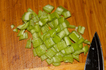 green bell pepper and a knife