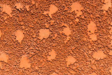 red striated stucco wall texture