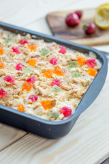 Homemade No-Bake Cheesecake with Strawberries, Marmalade and Cookies in Baking Dish for Birthday Party