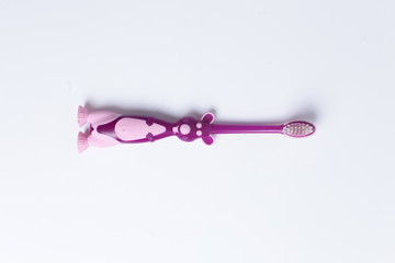 One purple baby toothbrush isolated over white background