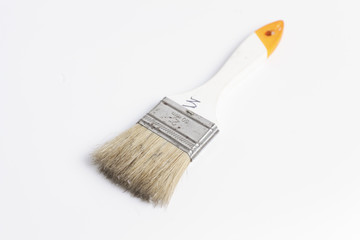 Paper cutting knife and clean paint brush isolated on white background