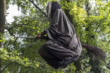 Flying witch scarecrow