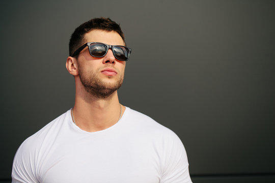 Hipster wearing white blank t-shirt with space for your logo