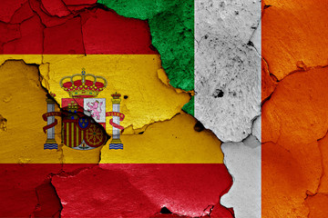 flags of Spain and Ireland painted on cracked wall