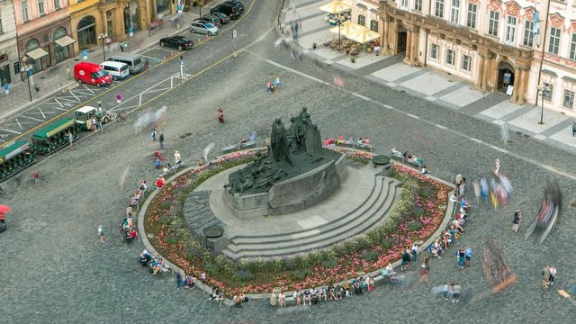 Aerial view of Old Town Square and Jan Hus monument timelapse. People sitting and walking around in Prague, Czech Republic