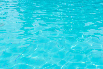 Fototapeta na wymiar blue swimming pool with sunny reflections