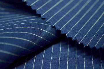 close up dark blue fabric of suit