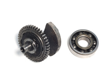 Part of crankshaft of motorcycle on white background