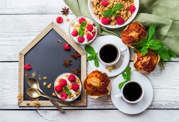 Breakfast concept. Coffee muesli granola berries homemade yogurt muffin